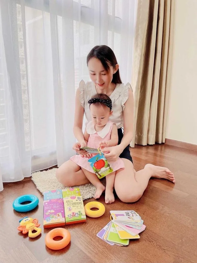 A parent learning with a child using Koko and Miko flashcards